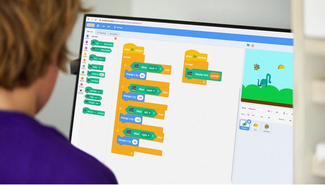 pupil using Scratch
