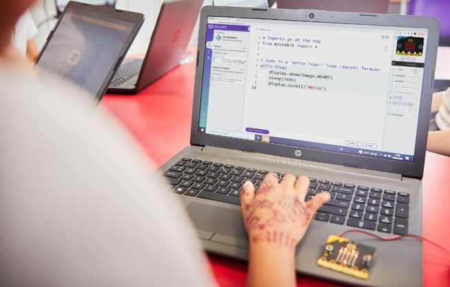 child using micro:bit Python editor