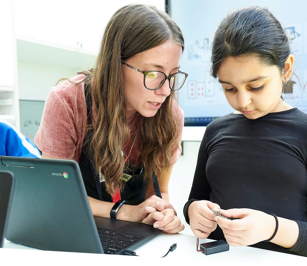 teacher helping pupil to explore the micro:bit 168